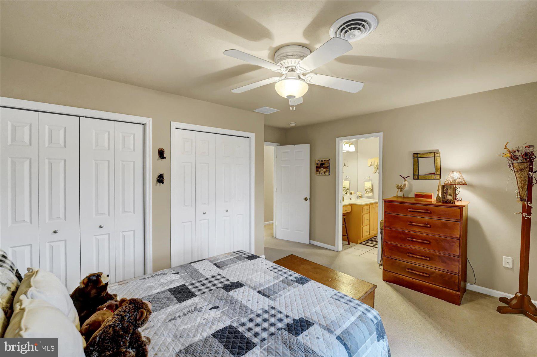 503 Robin Road Bellefonte, PA 16823 - Photo 37 of 72 a bedroom with a bed and a chandelier