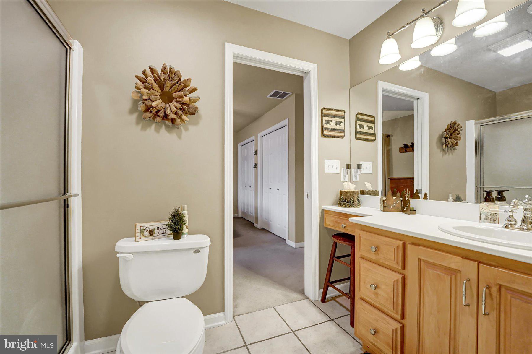 503 Robin Road Bellefonte, PA 16823 - Photo 38 of 72 a spacious bathroom with a toilet sink and mirror