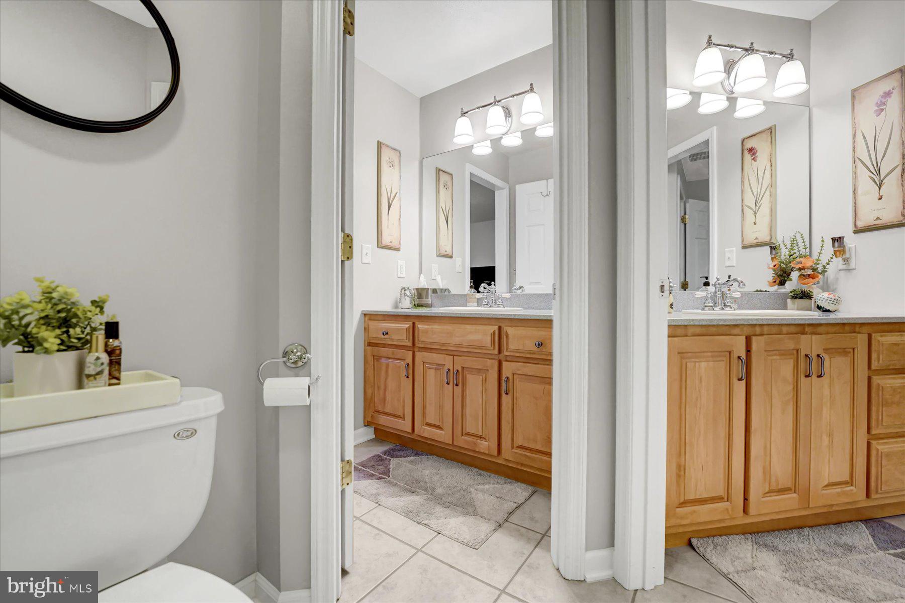 503 Robin Road Bellefonte, PA 16823 - Photo 45 of 72 a bathroom with a toilet a sink and a mirror