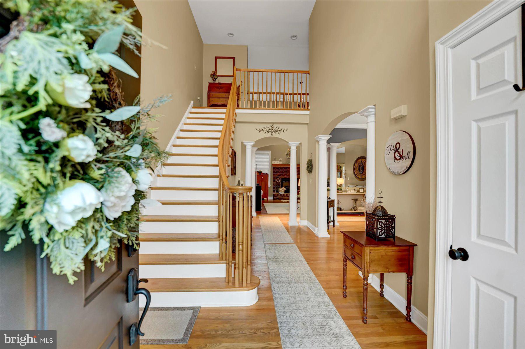 503 Robin Road Bellefonte, PA 16823 - Photo 6 of 72 a hallway with painting on the wall and a potted plant