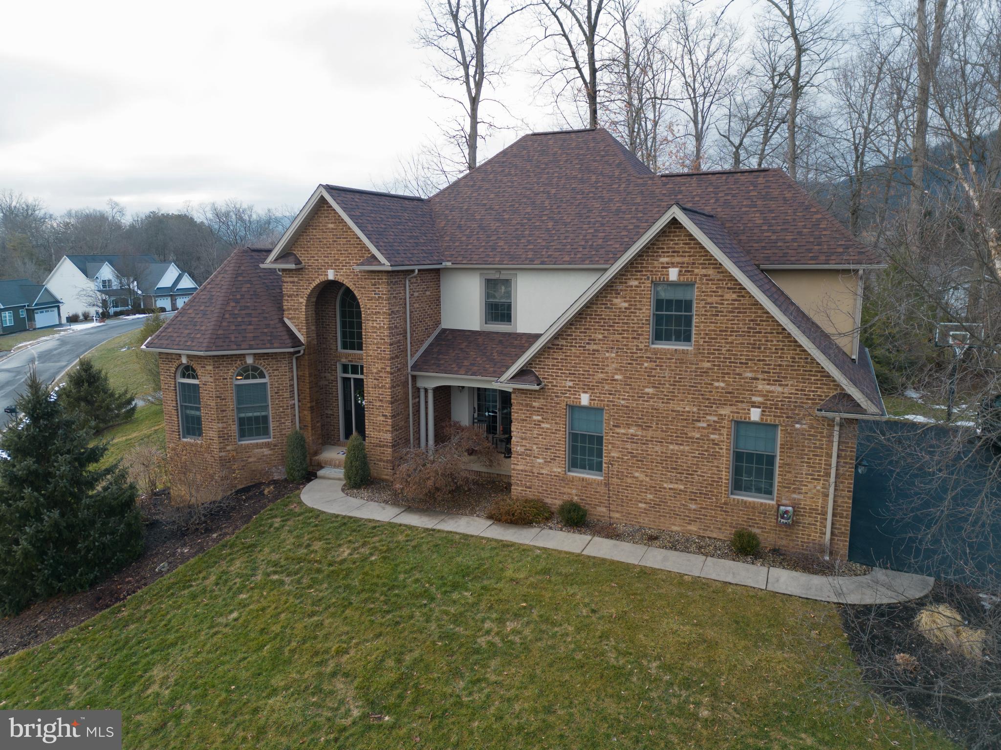 503 Robin Road Bellefonte, PA 16823 - Photo 62 of 72 a front view of a house with a yard and garage