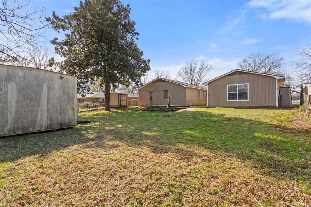 3126 Colgate Avenue Tyler, TX 75701 - Photo 32 of 33 a view of a house with a yard