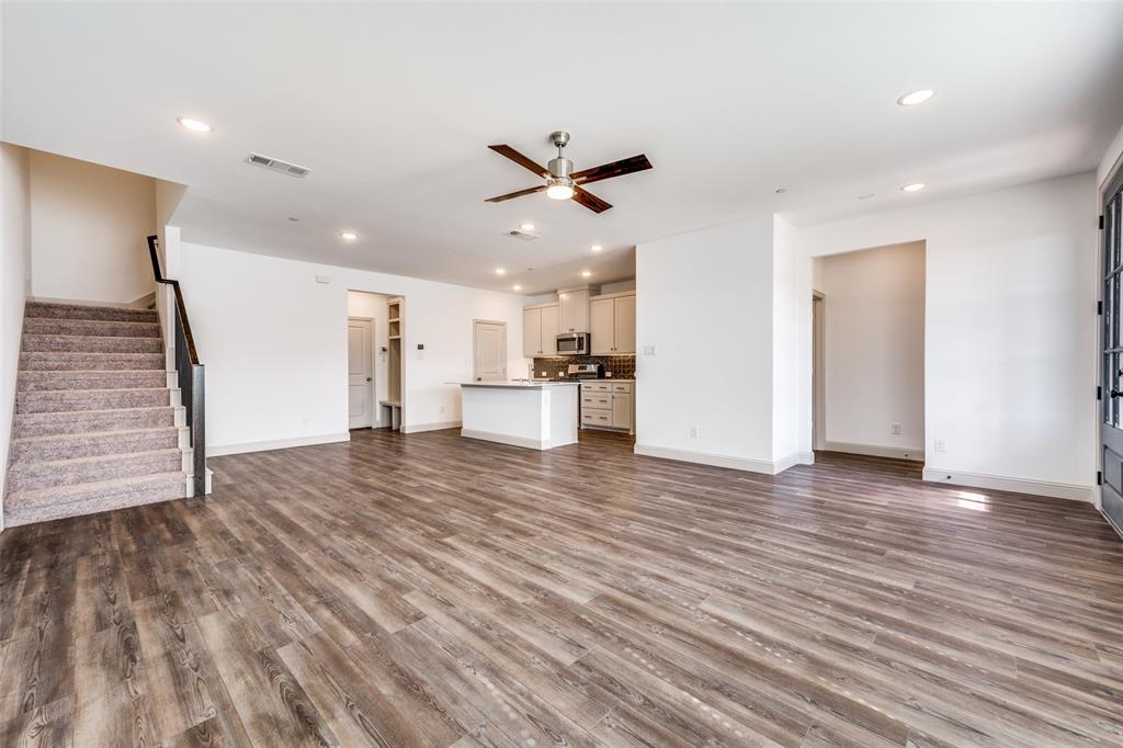 15866 Yellow Elder Road Frisco, TX 75035 - Photo 3 of 25 a view of a kitchen with wooden floor and a ceiling fan