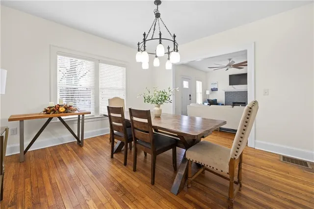 a view of a dining room with furniture window and wooden floor
