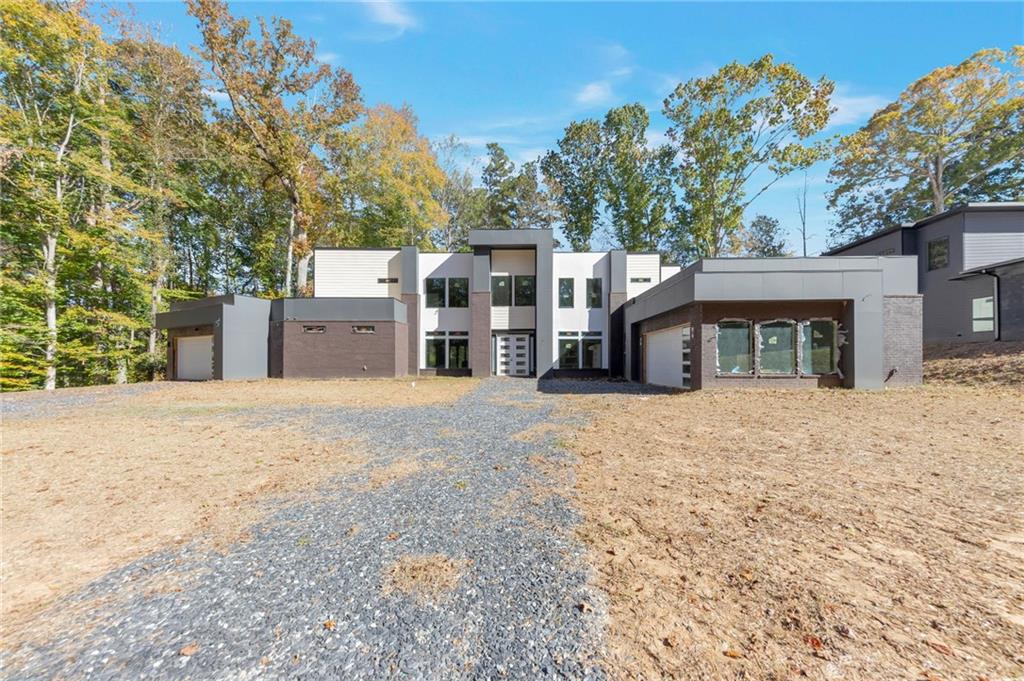 1690 Adams Drive Southwest Atlanta, GA 30311 - Photo 1 of 35 a view of a house with a yard and garage