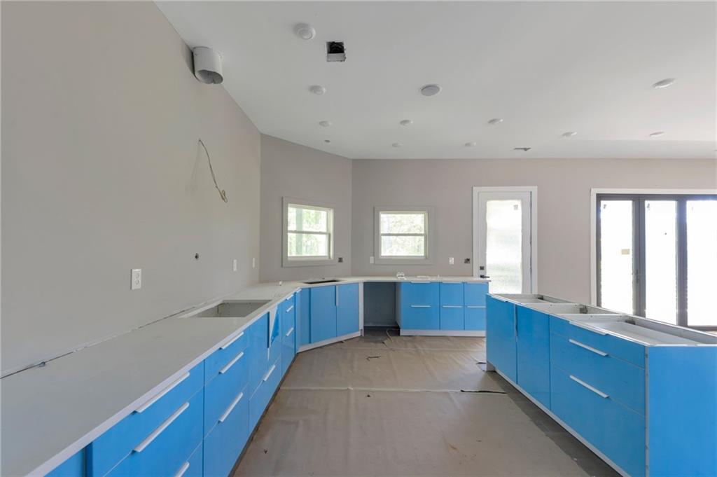 1690 Adams Drive Southwest Atlanta, GA 30311 - Photo 12 of 35 a large kitchen with lot of counter space and windows