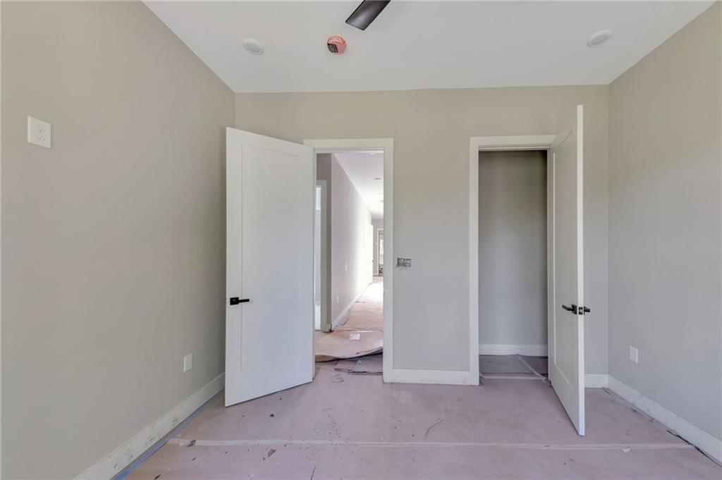1690 Adams Drive Southwest Atlanta, GA 30311 - Photo 14 of 35 an empty room with closet and mirror