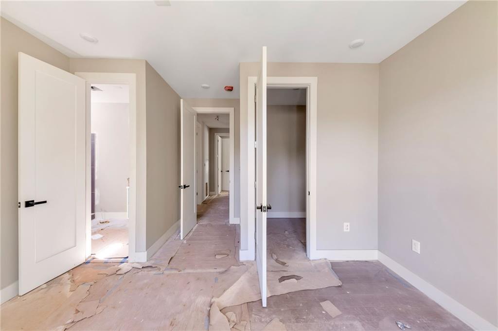 1690 Adams Drive Southwest Atlanta, GA 30311 - Photo 21 of 35 a view of a bathroom with a shower and a sink