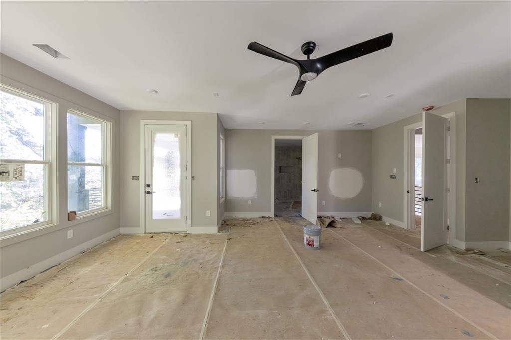 1690 Adams Drive Southwest Atlanta, GA 30311 - Photo 25 of 35 a view of a livingroom with a ceiling fan and window