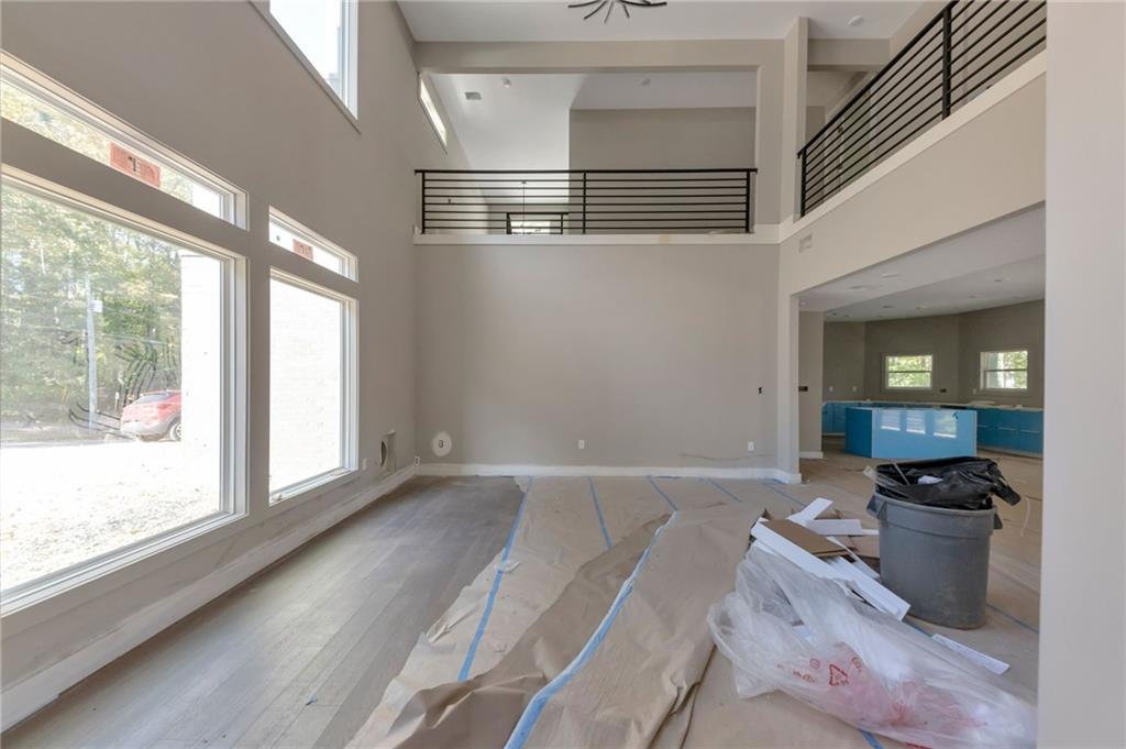 1690 Adams Drive Southwest Atlanta, GA 30311 - Photo 5 of 35 wooden floor in an empty room with a window