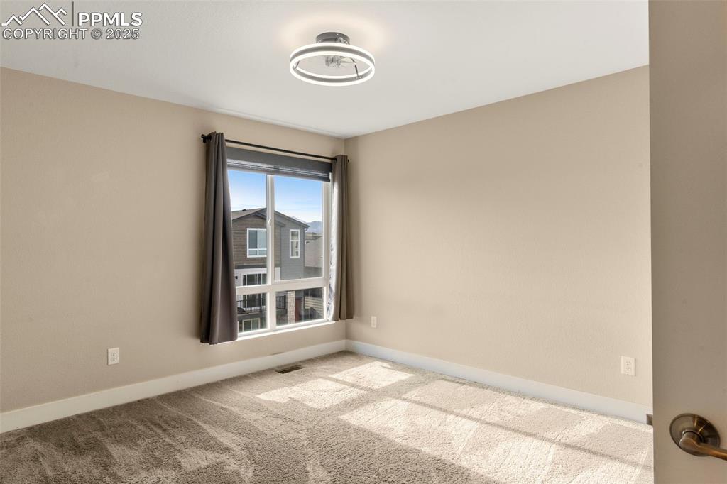1367 Plentiful Drive Colorado Springs, CO 80921 - Photo 14 of 28 a view of an empty room with a window