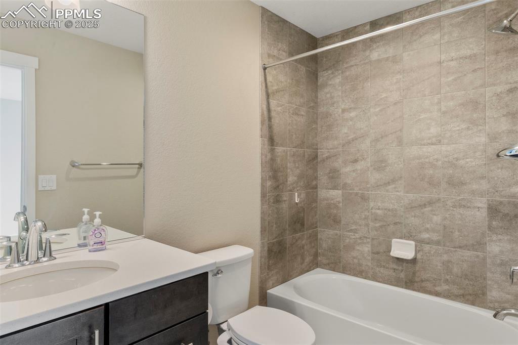 1367 Plentiful Drive Colorado Springs, CO 80921 - Photo 15 of 28 a bathroom with a sink toilet and shower