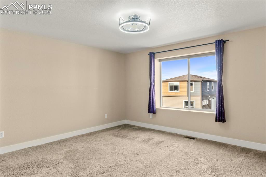 1367 Plentiful Drive Colorado Springs, CO 80921 - Photo 16 of 28 a view of an empty room with a window