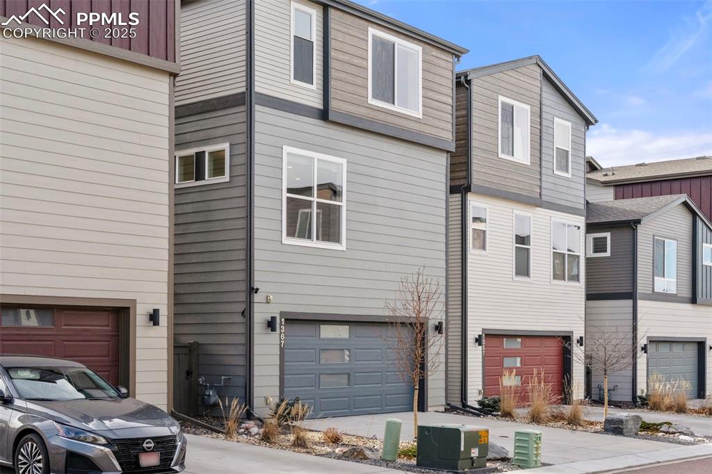 1367 Plentiful Drive Colorado Springs, CO 80921 - Photo 23 of 28 a front view of a building with parking space