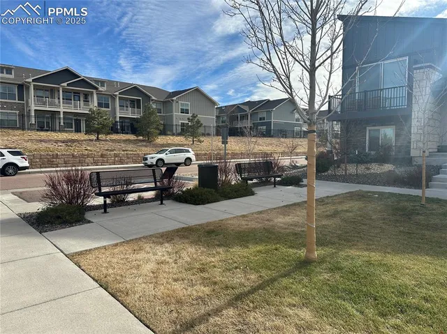 an aerial view of residential houses and street
