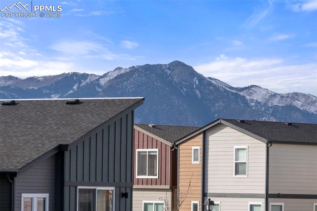 1367 Plentiful Drive Colorado Springs, CO 80921 - Photo 10 of 28 a front view of a house with a mountain