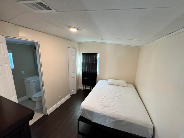 a very nice looking room with wooden floor