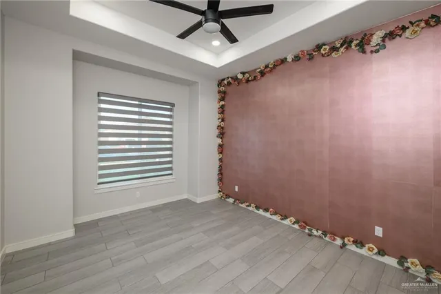 a view of a room with rack on the wall and a window