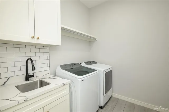 a kitchen with a sink and cabinets