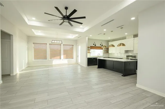 a view of kitchen with cabinets and wooden floor