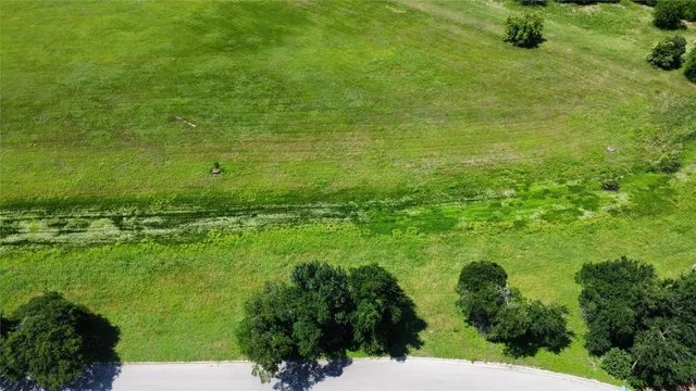 a view of a garden with a building