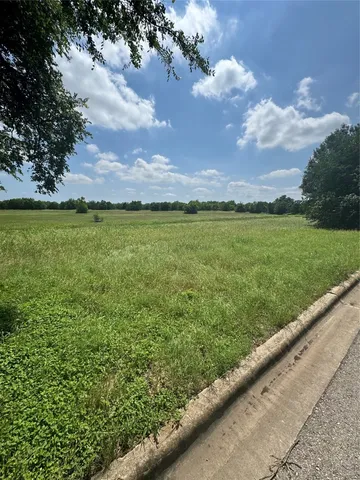 a view of a lake with a big yard