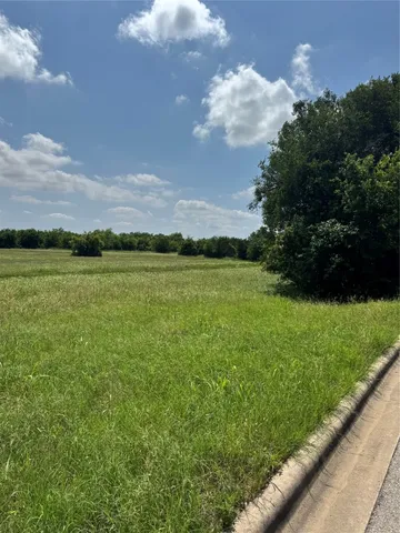 a view of a lake with a big yard
