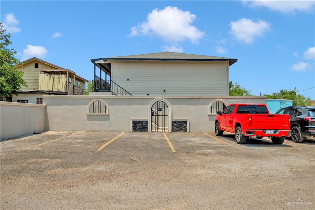 a front view of a house with parking area