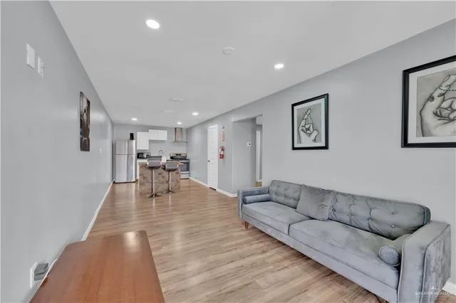 a living room with furniture and a table