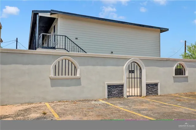 a view of a brick house with windows
