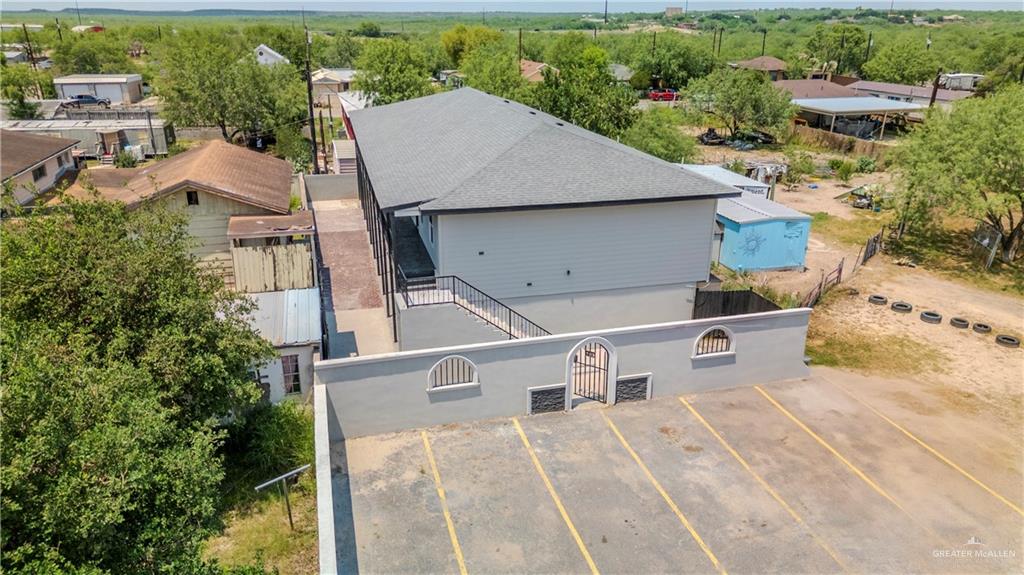 405 East Guerra Street Rio Grande City, TX 78582 - Photo 27 of 33 an aerial view of a house with a yard and seating space