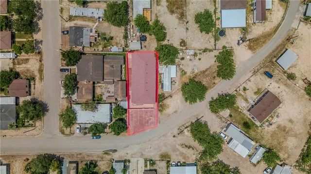 an aerial view of residential houses with outdoor space