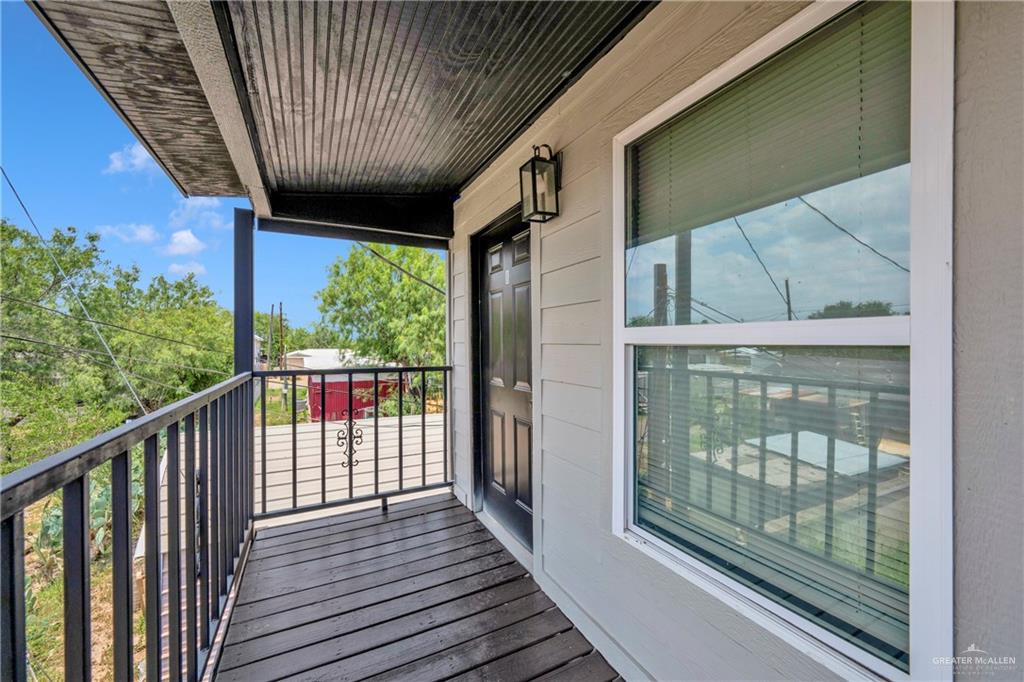 405 East Guerra Street Rio Grande City, TX 78582 - Photo 4 of 33 a view of a balcony with wooden floor