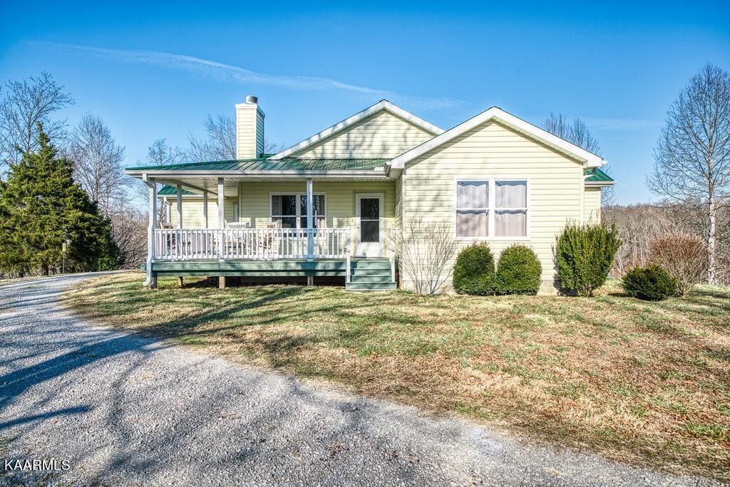 634 Mate Allen Road Red Boiling Springs, TN 37150 - Photo 2 of 38 a front view of a house with a yard