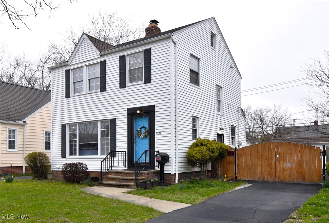 3921 Grosvenor Road Cleveland, OH 44118 - Photo 2 of 46 View of front of home with a gate and a chimney