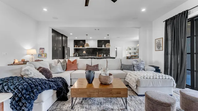 a living room with furniture and a lamp