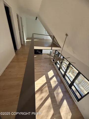 a view of empty room with a fireplace