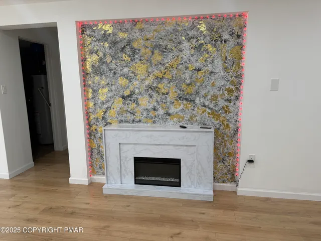 a close view of light fixtures and a mirror in a room