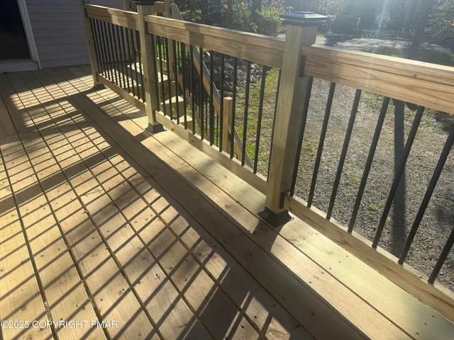 a view of balcony with wooden floor