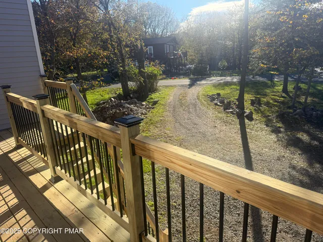 a view of a balcony with chairs