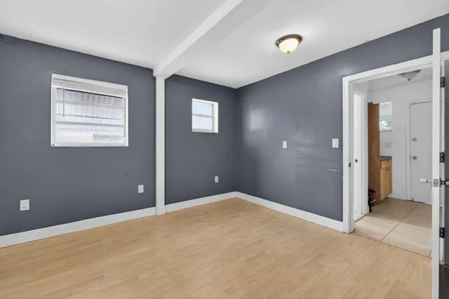 a bathroom with a toilet sink shower and mirror