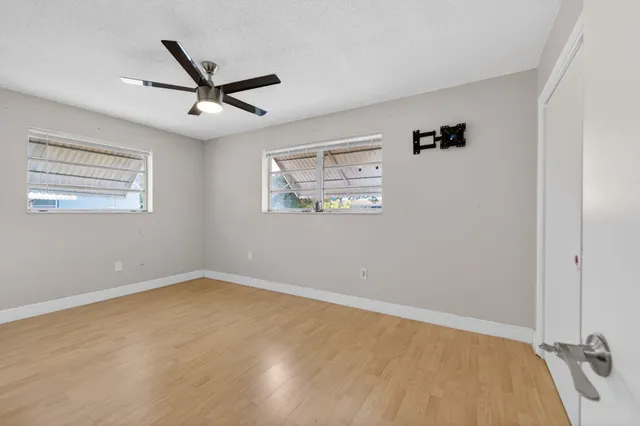 an empty room and window in a room