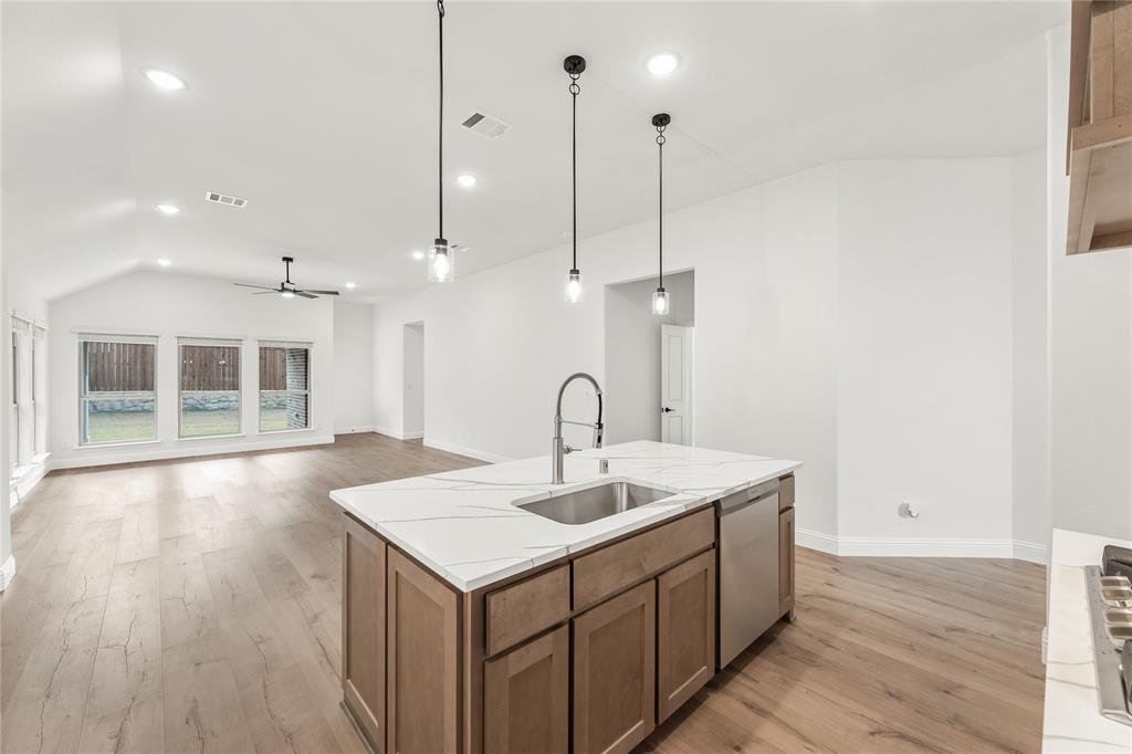 14509 Lovelace Street Pilot Point, TX 76258 - Photo 12 of 35 a view of a bathroom with a sink and mirror