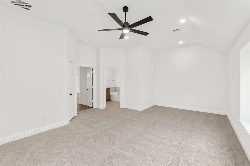 14509 Lovelace Street Pilot Point, TX 76258 - Photo 19 of 35 an empty room with closet and ceiling fan