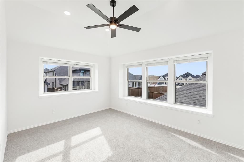 14509 Lovelace Street Pilot Point, TX 76258 - Photo 26 of 35 a view of an empty room with a window and a ceiling fan