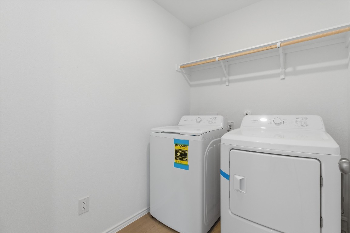 596 Sormonne Loop Kyle, TX 78640 - Photo 13 of 25 a utility room with dryer and washer
