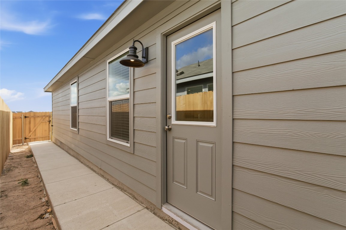596 Sormonne Loop Kyle, TX 78640 - Photo 19 of 25 a balcony view with a glass door