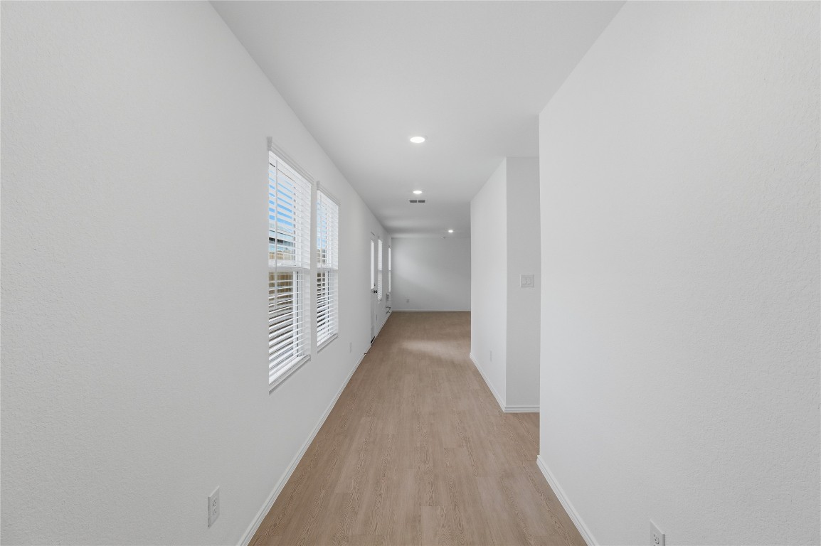 596 Sormonne Loop Kyle, TX 78640 - Photo 2 of 25 a view of a hallway