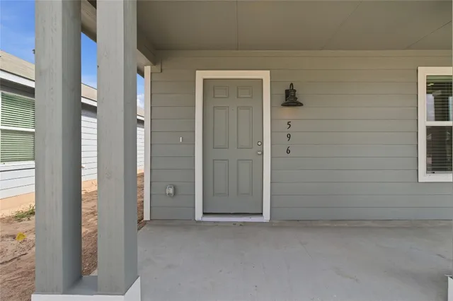 a balcony view with a glass door
