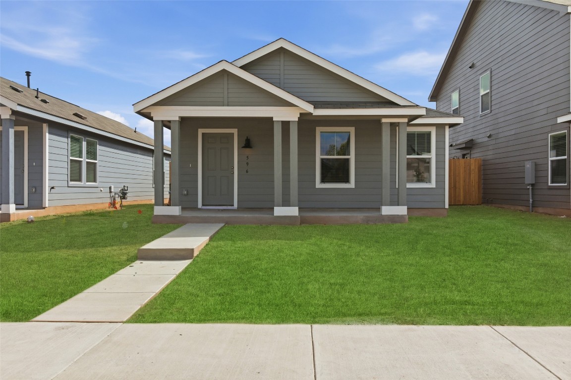 596 Sormonne Loop Kyle, TX 78640 - Photo 21 of 25 a front view of a house with a yard